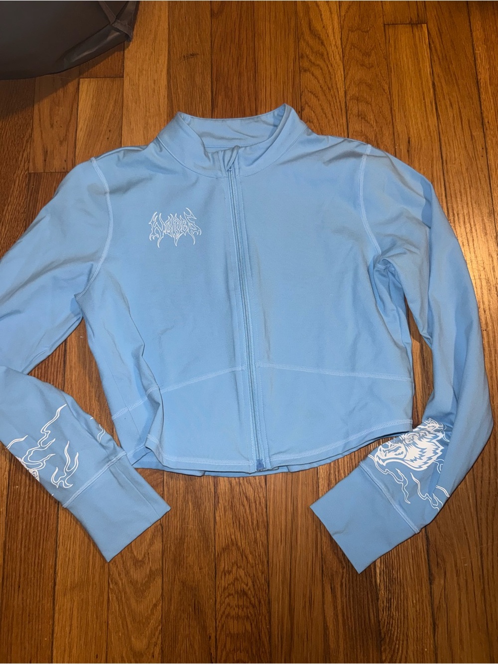 Darc Sport Light Blue Zip-Front Women's Top with Graphic Detail